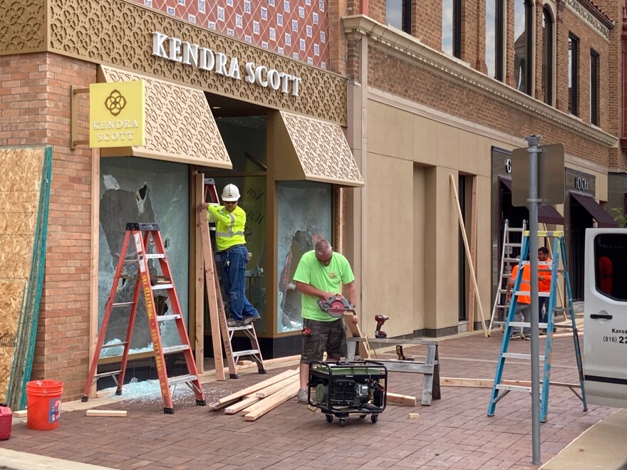 Crews arrived at Country Club Plaza early Sunday to repair damage that resulted from Saturday night's protest.