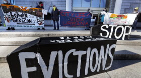 In this Jan. 13, 2021, file photo, tenants' rights advocates demonstrate in front of the Edward W. Brooke Courthouse in Boston. 