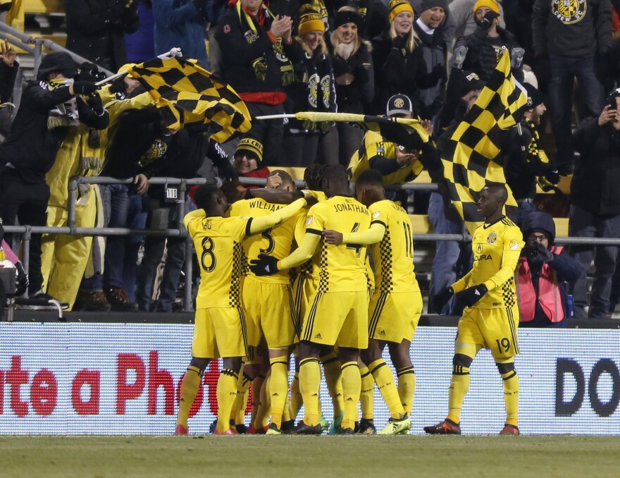 Columbus Crew players celebrate a goal.