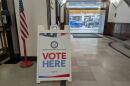 A "Vote Here" sign at an early voting location