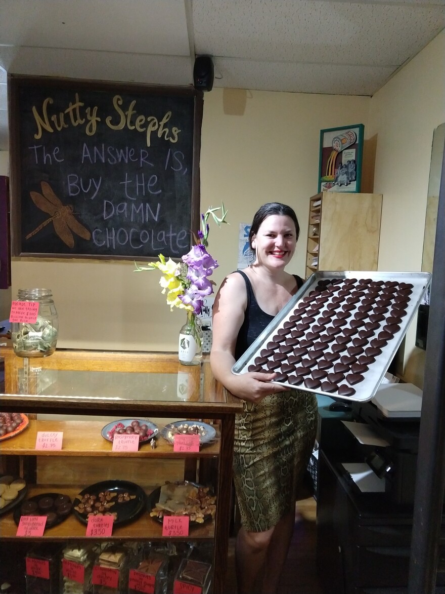 Nutty Steph's owner Jacqueline Fernandez-Riki holds a pan of CBD chocolate hearts.