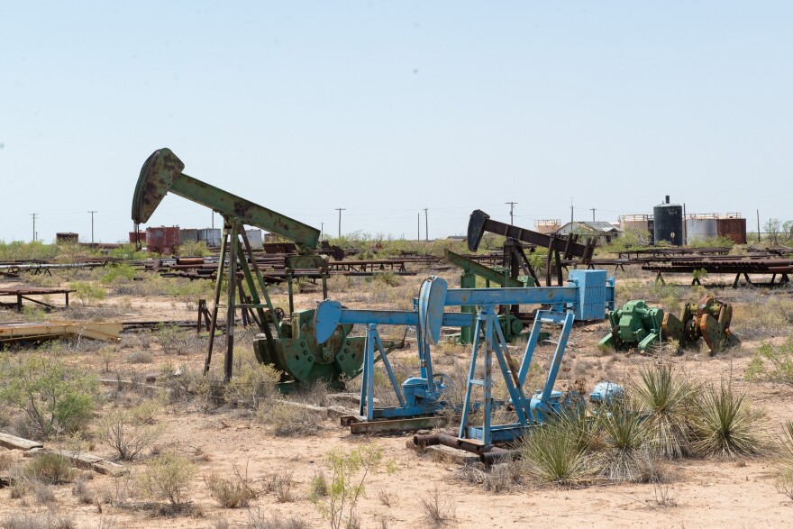 South east of where Oxy plans to drill its CO2 injection wells, old oil field equipment rust on the side of the road in Penwell.