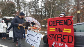 Shane Weeks, co-chair of the Shinnecock Graves Protection Society, offers encouragement to members of the Shinnecock Indian Nation rallying in Southampton, N.Y., near their federally recognized tribal territory, on Monday, Feb. 7, 2022, to call for local town officials to use a special preservation fund to purchase culturally sensitive properties to return to the tribe.