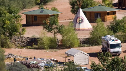 Investigators comb the Angel Valley Retreat Center near Sedona, Ariz. following the deaths of three people at a 2009 retreat.