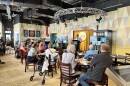 Attendees listen to a presentation at the National Comedy Center's Memory Cafe on October 6, 2025 in Jamestown, New York.