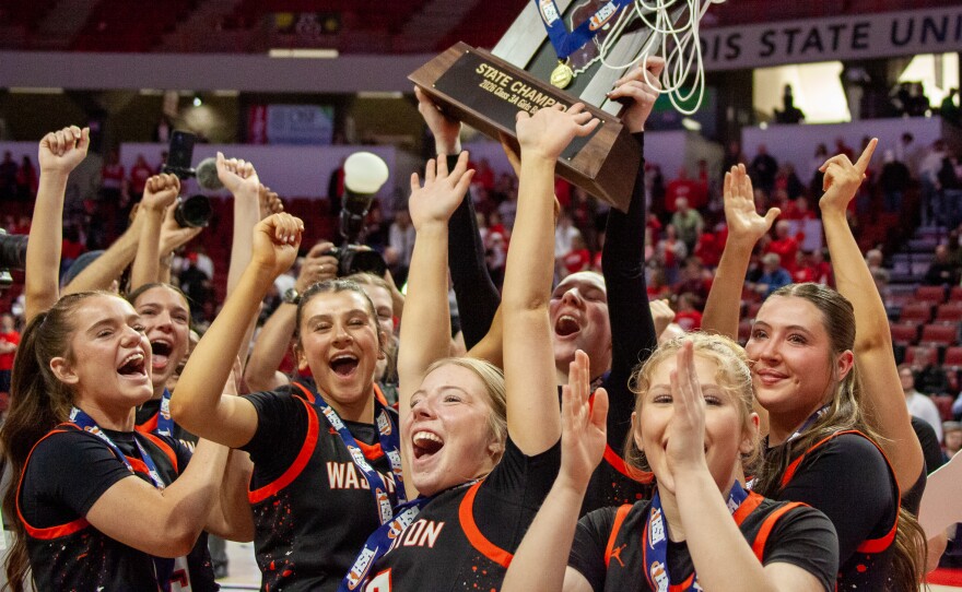 Girls high school basketball players inside an arena