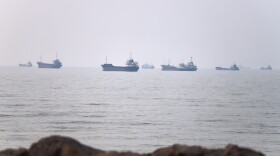 Commercial vessels are seen in the Strait of Hormuz off Bandar Abbas, Iran, Tuesday, June 30, 2026. (Amirhosein Khorgooi/ISNA via AP)