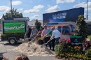 The sand flies as city officials take part in the ceremonial groundbreaking.