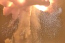 A rocket explodes during an engine-firing test 