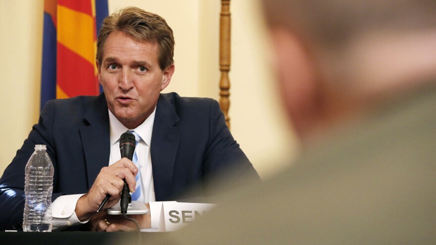 Sen. Jeff Flake, left, R-Ariz., who announced he will not run for reelection on Tuesday, appears at a hearing on border security in Arizona in 2015.