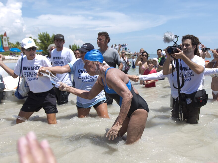 Diana Nyad struggles to come ashore in Key West on Sept. 2, 2013, after completing her swim from Cuba.