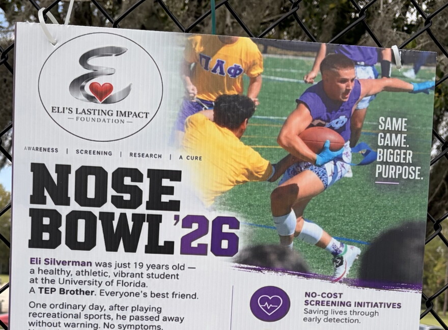 An image of Eli Silverman is seen on a poster promoting this year's Nose Bowl. (Madison Middleton/WUFT News)