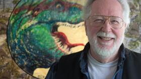 Stephen R. Bissette, photographed at his home in Windsor, Vt., with a quilt depicting "TYRANT®," a tyranosaurus rex character he created, on Tuesday, March 24, 2026, will be named the state's cartoonist laureate on April 9 in Montpelier. (Valley News photo)
