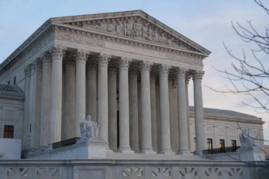  Front of U.S. Supreme Court building with pillars and statues