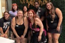 Sarah Chojnacki (left front) and Ashley Mertes (right front) pose with a group of friends and volunteers at the first Fat Body Hotties clothing swap hosted at Sherman Phoenix on Aug. 02, 2025.