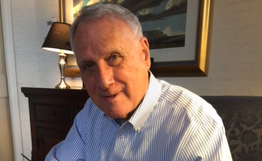 Jon Kyl wearing a blue and white striped shirt