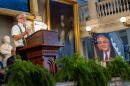 Barney Frank’s widower, Jim Ready, speaks at the podium during a "celebration of life" ceremony for the late congressman in Boston. (Jesse Costa/WBUR)