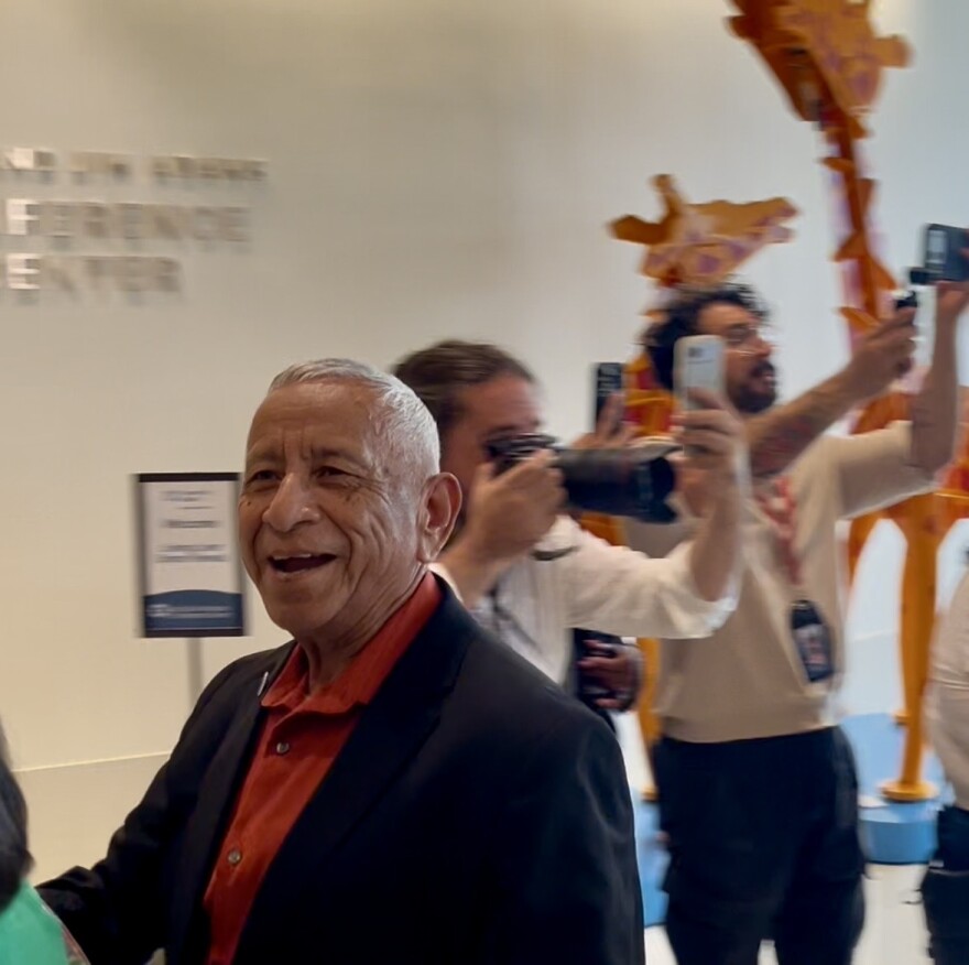 Liver recipient Vidal Moreno being congratulated by a line of supporters, family, friends, and doctors at University Hospital