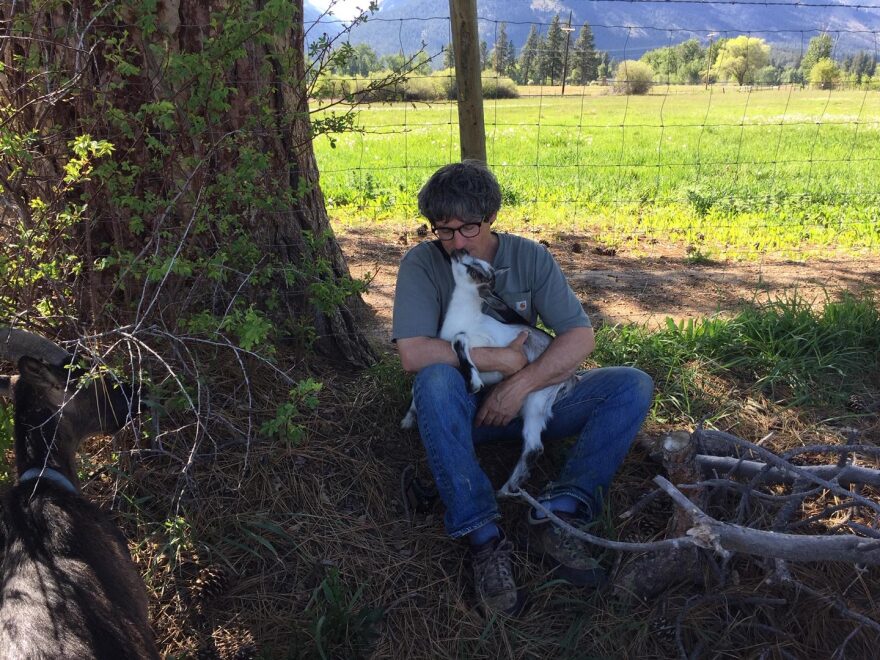 Sam Manno holding a goat.