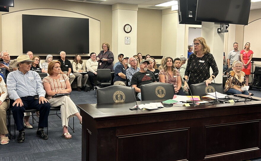 Janet Garrison from Mason County spills letters of support from people across the country who support their efforts to stop data center development in their rural community.