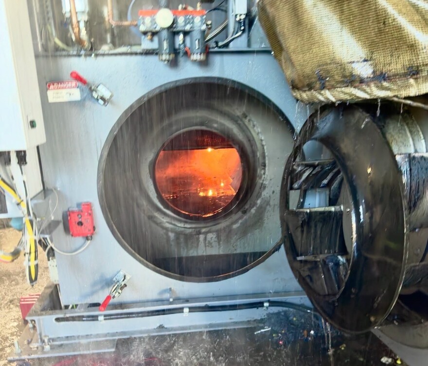 A burning dryer inside the former Aramark building in the 1100 block of Florence St., Evansville, IN, July 30, 2026