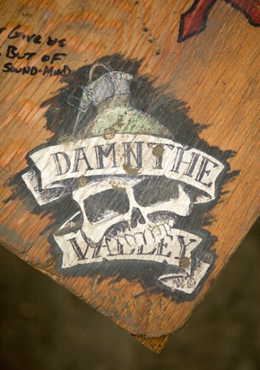 Photographer Tim Hetherington and journalist Sebastian Junger were embedded with Battle Company of the U.S. Army?s 173rd Airborne Brigade. They were stationed in Korengal Valley in Afghanistan - referenced in this soldiers drawing.