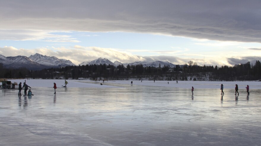 Ice skaters in Anchorage, Alaska, take advantage of higher than average temperatures at Westchester Lagoon.