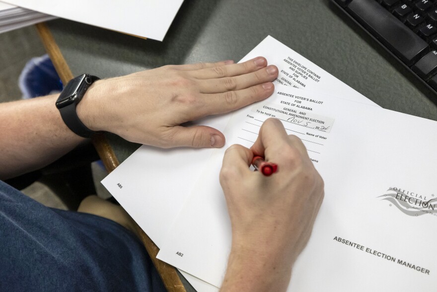 FILE - Trey Forrest, Absentee Election Coordinator for the Jefferson County/Birmingham (Ala.) Division, prepares absentee ballots for the November election, Sept. 10, 2024, in Birmingham, Ala. (AP Photo/Vasha Hunt, File)