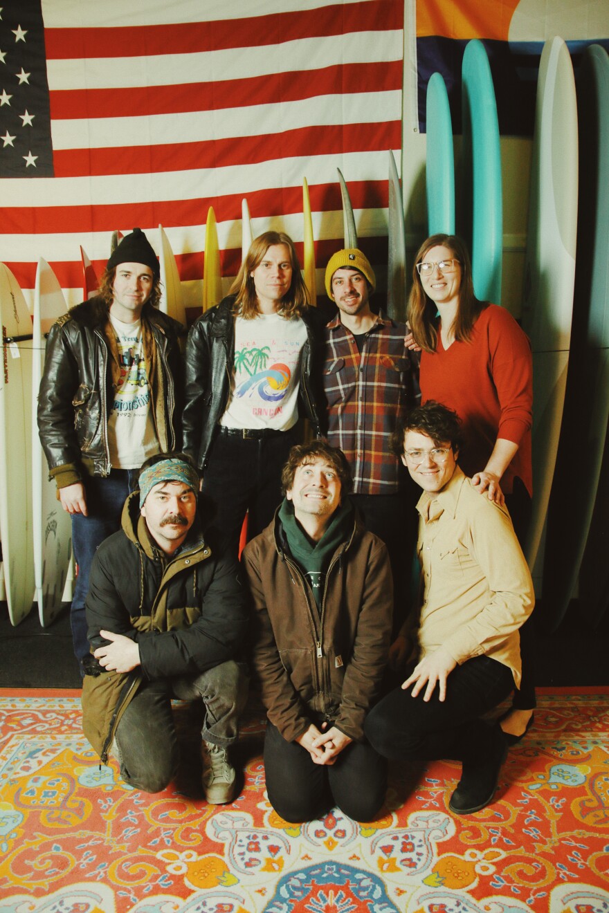 (Top row, left to right) Night Moves founder, guitarist, and lead vocalist John Pelant, guitarist Charles Murlowski, Lake Effect Surf Shop owner Jake Bresette, and Lake Effect's Audrey Nowakowski. (Bottom row, left to right) Night Moves drummer Mark Hanson, bassist Micky Alfano, and Milwaukee musician Trapper Schoepp.