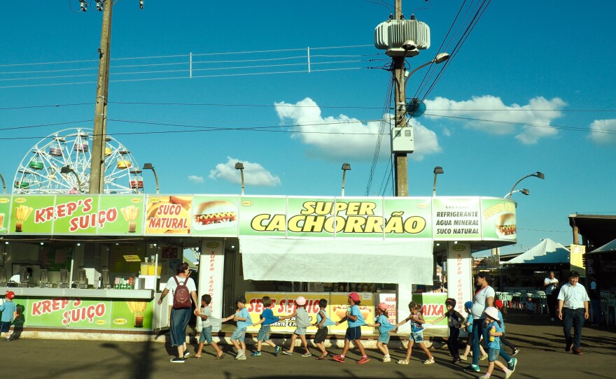 Children visit the food stall section of Expo Londrina, an agricultural fair in the southern Brazilian city.