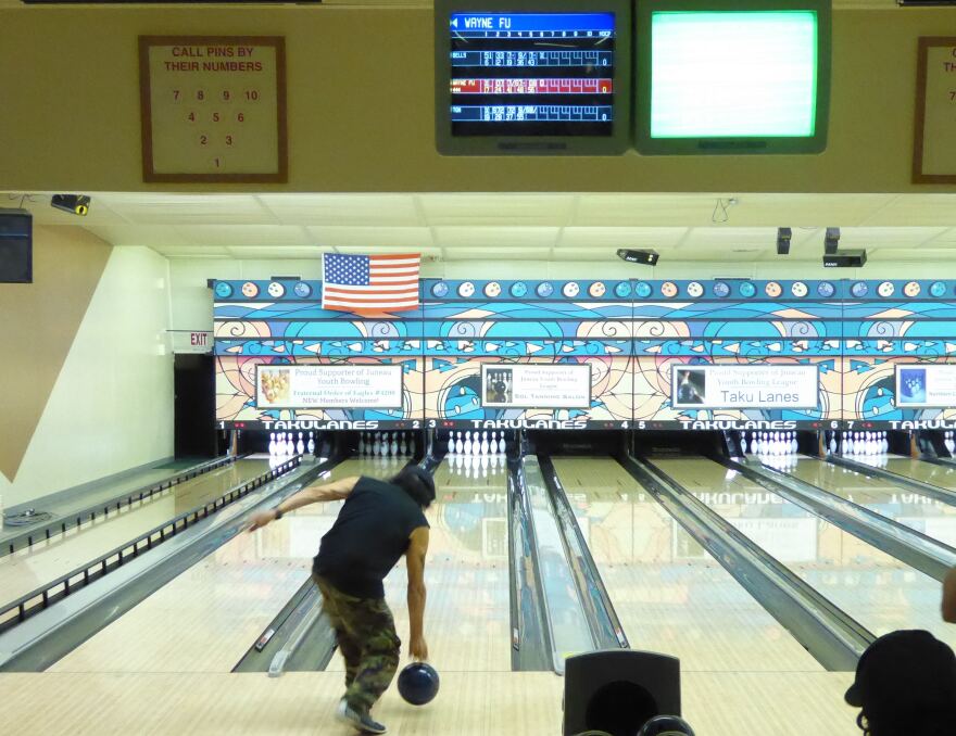 Wayne Fu Smallwood bowls at Taku Lanes on Saturday. (Photo by Quinton Chandler/KTOO)