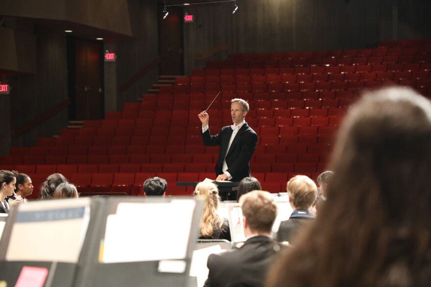 Interlochen Arts Academy Band Director Matthew Schlomer leads students in a recent dress rehearsal.