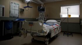 An empty ICU bed waits for a patient to arrive on Sunday, Nov. 23, at SSM Health St. Joseph Hospital in Lake Saint Louis, Mo. St. Joseph has had to expand their COVID-19 unit to other branches of the hospital since their ICU hit its capacity.