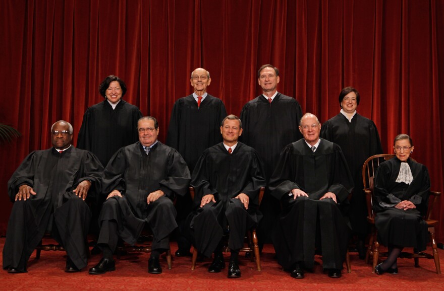 The U.S. Supreme Court justices (first row, from left) Clarence Thomas, Antonin Scalia, Chief Justice John Roberts, Anthony Kennedy, Ruth Bader Ginsburg, (back row) Sonia Sotomayor, Stephen Breyer, Samuel Alito and Elena Kagan.