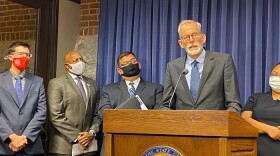  Brian Richard, of the Northern Illinois University Center for Governmental Studies, is pictured at a news conference at the Illinois State Capitol. He is the author of a report showing the economic impact of community colleges.