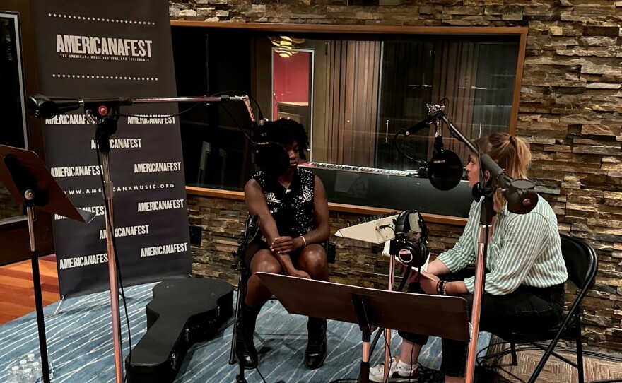KAXE Music Director Kari Hedlund, right, interviews Sunny War at AmericanaFest 2023 in Nashville.