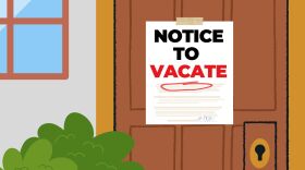 A graphic notice to vacate sign on the door of a house.