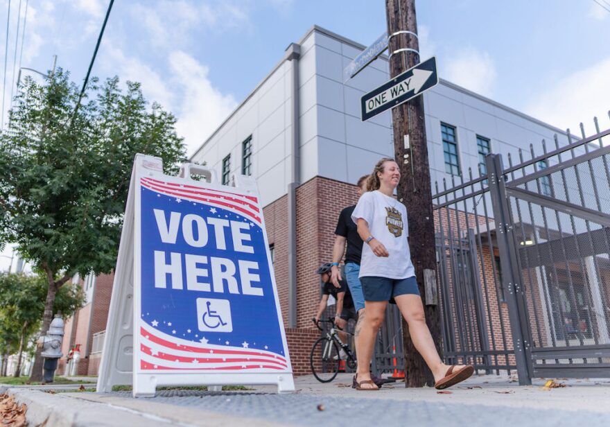 Voters leave the Bricolage Academy gym after casting their ballots in New Orleans, Tuesday, Nov. 5, 2024.