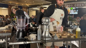 Chef Aaron Gardner prepares his entrées for the judges.