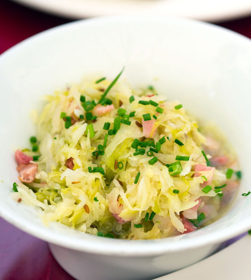 "Warmer Speckkrautsalat" is a Tyrolean cabbage and speck (Tyrolean cured ham) salad served warm. 