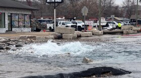Water pours from a water main break on Thomaston Avenue in Waterbury on Saturday.