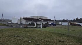 An airport facility behind a fence.