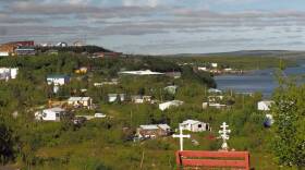 Collection of buildings on a grassy hill
