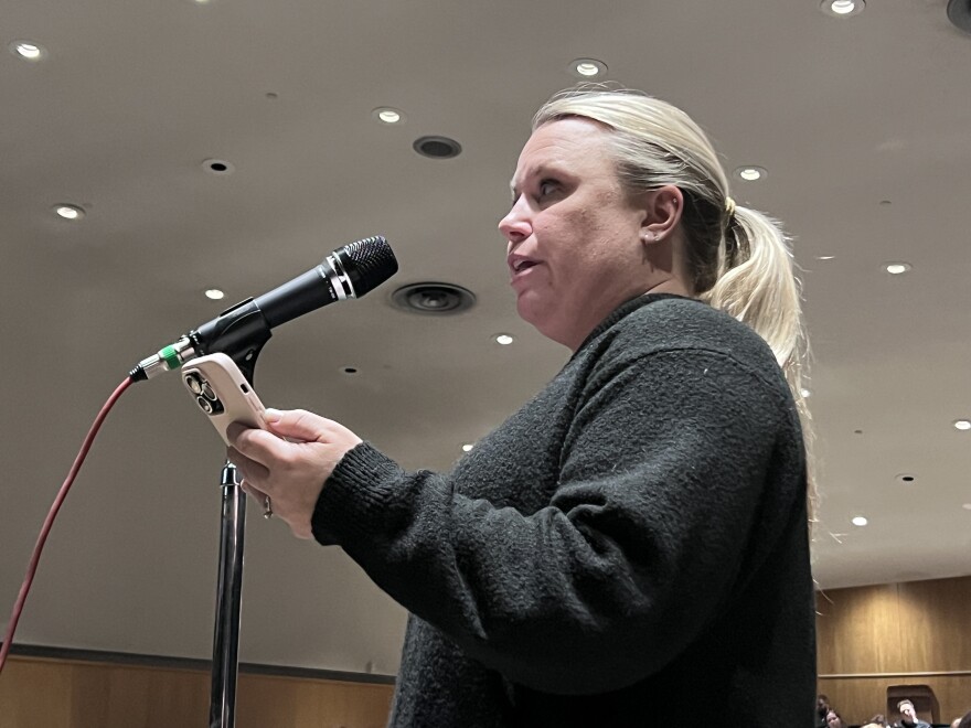 Parent Kalee Fosso expresses concerns about the closure of Greenhaven Elementary School at a March 26, 2026, public hearing at Lincoln Middle School in Hibbing.