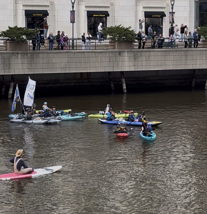 Some Brewers fans watched the parade from the Milwaukee River.