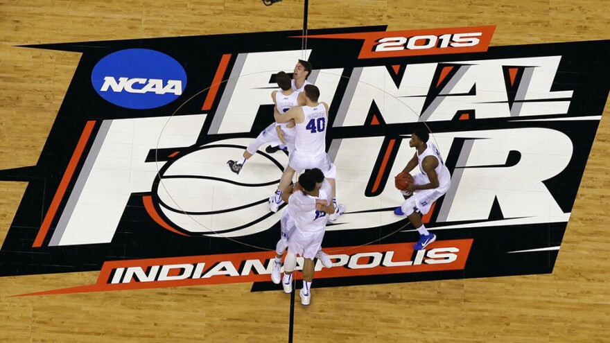 FILE - Duke players celebrate after the NCAA Final Four college basketball tournament championship game against Wisconsin in Indianapolis, in this Monday, April 6, 2015, file photo. The NCAA announced Monday, Nov. 16, 2020, it plans to hold the entire 2021 men’s college basketball tournament in one geographic location to mitigate the risks of COVID-19 and is in talks with Indianapolis to be the host city.