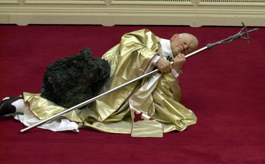 Maurizio Cattelan's waxwork depicting Pope John Paul II after being struck by a meteorite was on display in Sept. 2000 at the Royal Academy in London.