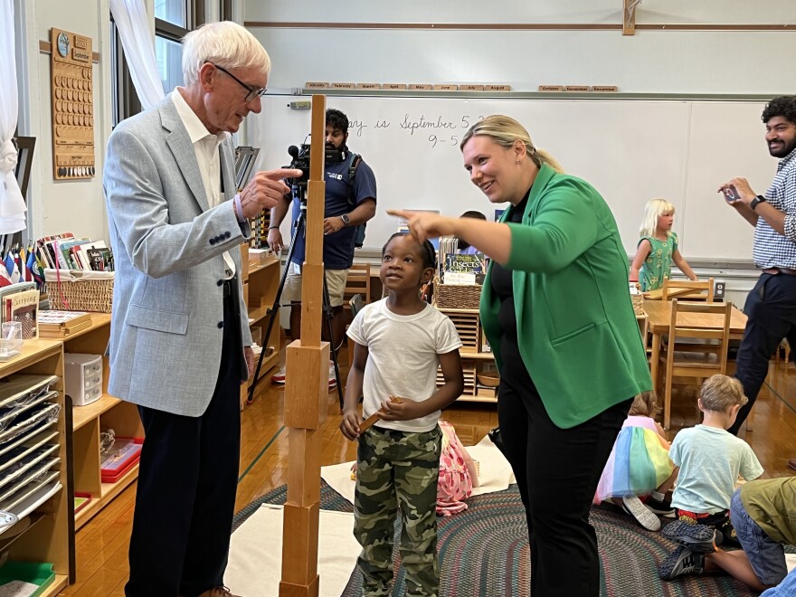 Gov. Tony Evers and MPS Board member Missy Zombor interact with a student at Maryland Avenue Montessori on the first day of school.