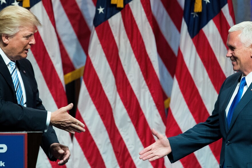 Republican presidential candidate Donald Trump introduces his newly selected running mate, Indiana Gov. Mike Pence, in New York City on Saturday.
