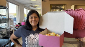 Theresa Jackson, a Yuma native, picks up a birthday cake for her granddaughter's first birthday.